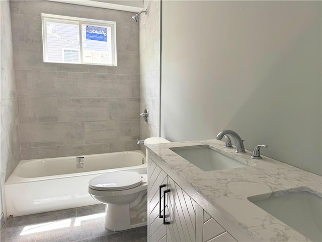 full bath featuring vanity, shower / bathing tub combination, and toilet