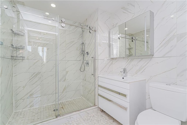 full bath featuring tile walls, toilet, a marble finish shower, vanity, and recessed lighting