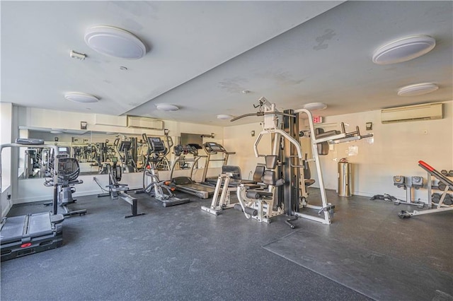 exercise room featuring an AC wall unit
