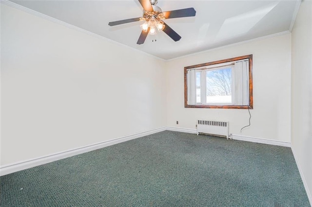 spare room featuring crown molding, dark colored carpet, baseboards, radiator, and a ceiling fan