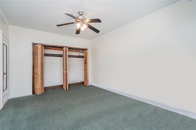 unfurnished bedroom with ornamental molding, carpet flooring, ceiling fan, and baseboards