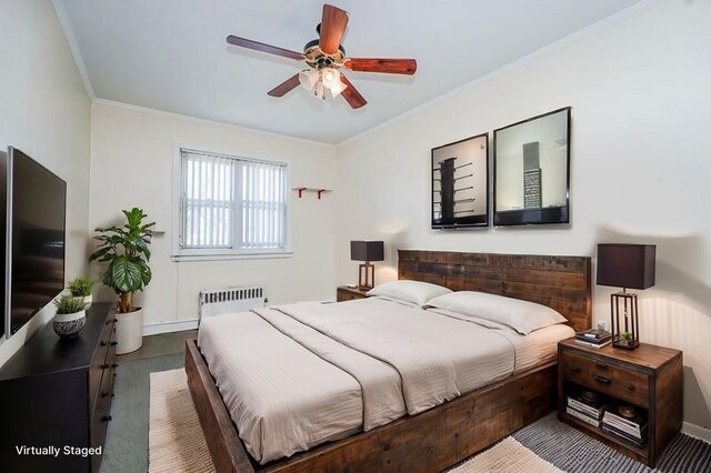 bedroom with radiator heating unit, a ceiling fan, ornamental molding, and baseboards