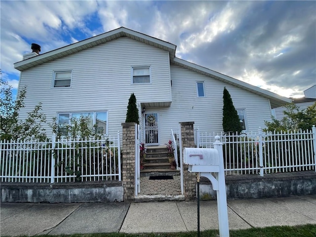 view of front of house with fence