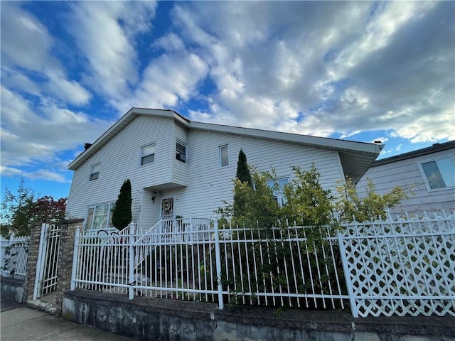view of front facade featuring fence