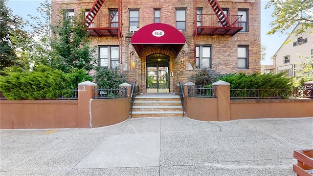 460 Ovington Ave Unit 3G, Brooklyn, NY 11209 - view of exterior entry featuring brick siding and french doors