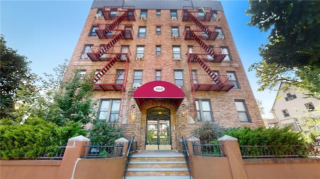 460 Ovington Ave Unit 3G, Brooklyn, NY 11209 - view of apartment building / complex featuring stairs and a fenced front yard