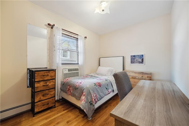 8719 Bay 16th St Unit 3A, Brooklyn, NY 11214 - bedroom featuring a baseboard radiator, wood finished floors, and cooling unit