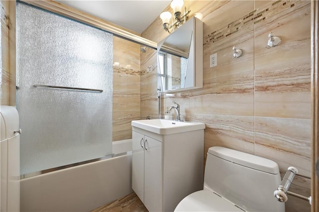 2260 Benson Ave Unit 5C, Brooklyn, NY 11214 - full bath featuring vanity, toilet, tile walls, bath / shower combo with glass door, and backsplash