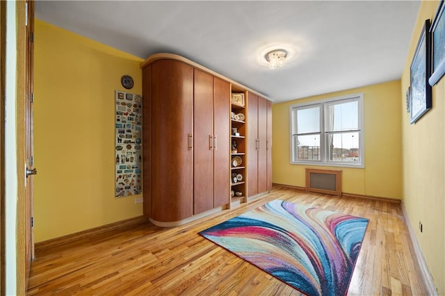 2260 Benson Ave Unit 5C, Brooklyn, NY 11214 - bedroom with light wood-style floors and baseboards
