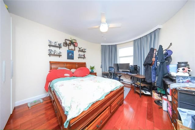 bedroom featuring a ceiling fan and wood finished floors