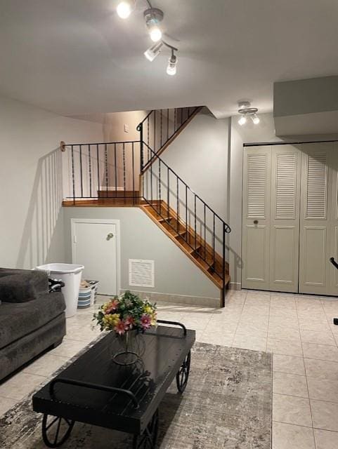 20 Linda Ln, Staten Island, NY 10312 - living room featuring stairs, light tile patterned flooring, and visible vents