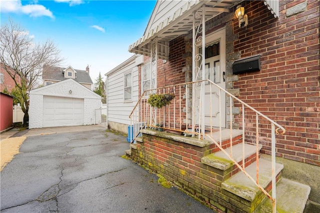 95 Bryson Ave, Staten Island, NY 10302 - doorway to property with asphalt driveway, a garage, and brick siding