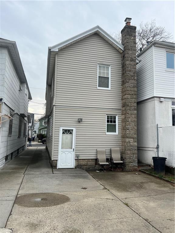 rear view of house with fence