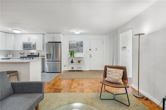 living room featuring baseboards