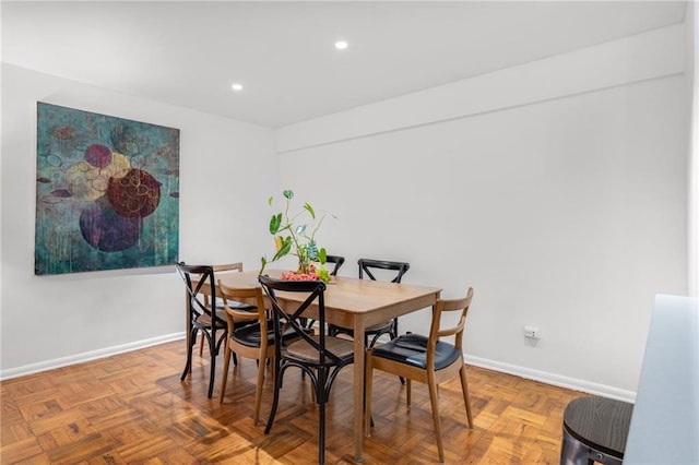 dining area with baseboards and recessed lighting