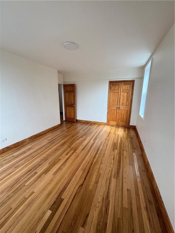 2239 Troy Ave Unit 3N, Brooklyn, NY 11234 - empty room with wood finished floors and baseboards