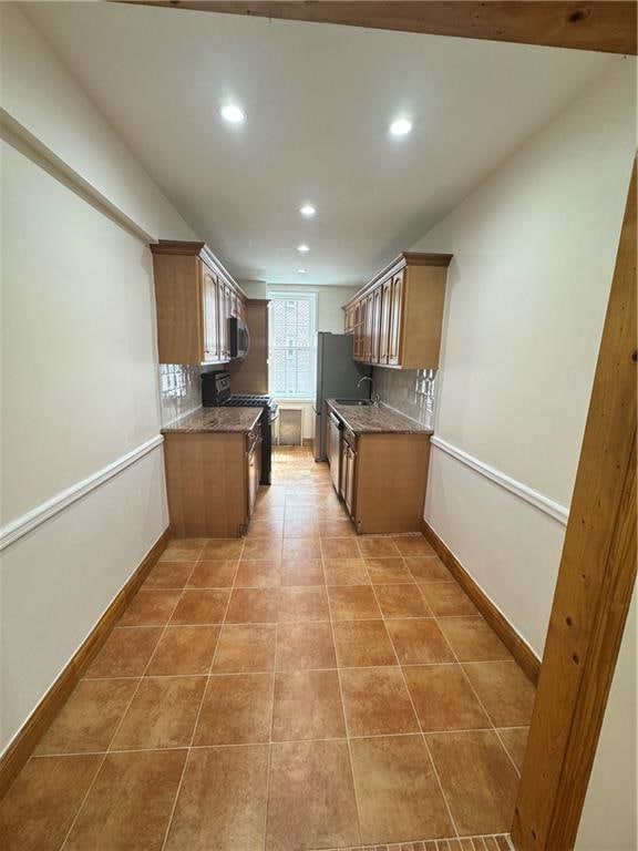 2239 Troy Ave Unit 3N, Brooklyn, NY 11234 - kitchen with gas stove, recessed lighting, a sink, tasteful backsplash, and light tile patterned floors