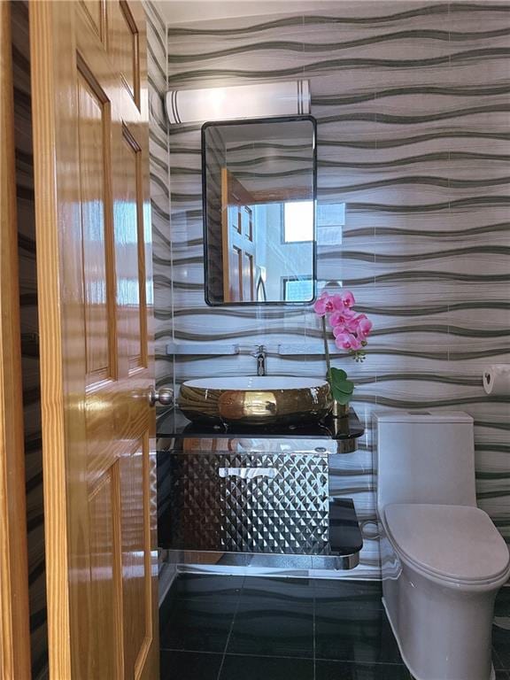 31-47 137th St Unit 4B, Brooklyn, NY 11354 - bathroom featuring toilet and tile patterned floors