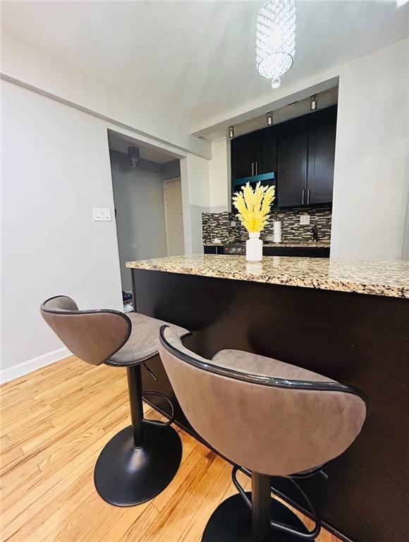 2807 Kings Hwy Unit 4C, Brooklyn, NY 11229 - dining room with light wood finished floors and baseboards