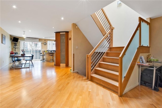 2556 E 26th St, Brooklyn, NY 11235 - stairway with wood finished floors and recessed lighting