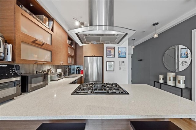282 21st St Unit 2C, Brooklyn, NY 11215 - kitchen featuring black appliances, island exhaust hood, a peninsula, a sink, and a breakfast bar area