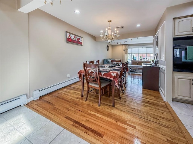 dining area featuring light wood-style flooring, visible vents, recessed lighting, a chandelier, and a baseboard radiator