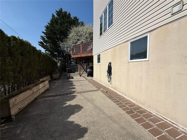 view of property exterior with a patio and stucco siding