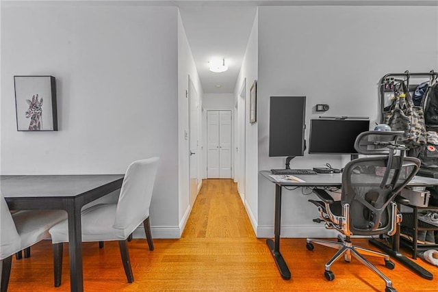 office space featuring light wood finished floors and baseboards