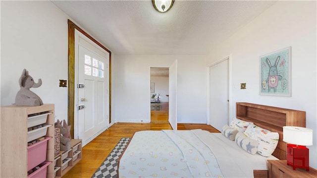 7401 Shore Rd Unit 6F, Brooklyn, NY 11209 - bedroom with light wood-style floors and a textured ceiling