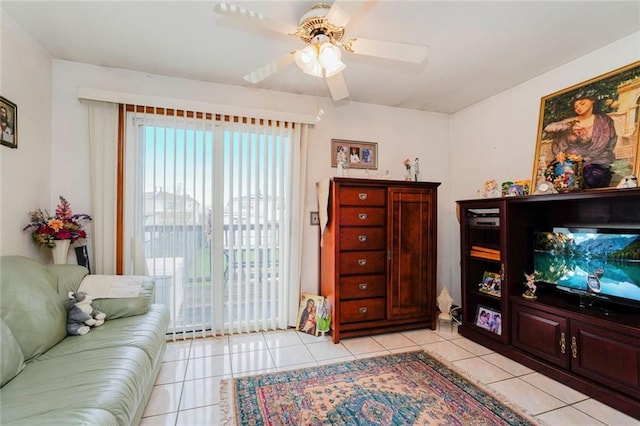 living room featuring light tile patterned floors and a ceiling fan