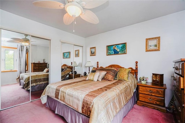bedroom with a ceiling fan, carpet floors, and multiple closets
