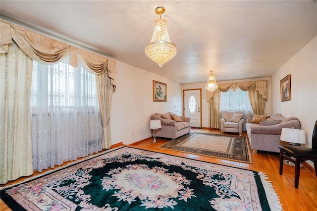 living room featuring a chandelier and wood finished floors
