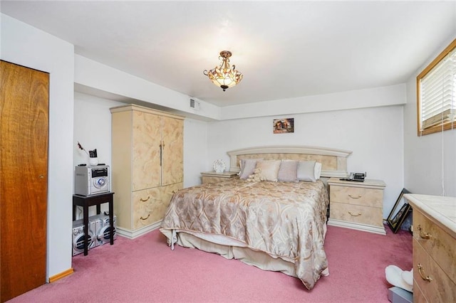 bedroom featuring visible vents, carpet floors, and baseboards