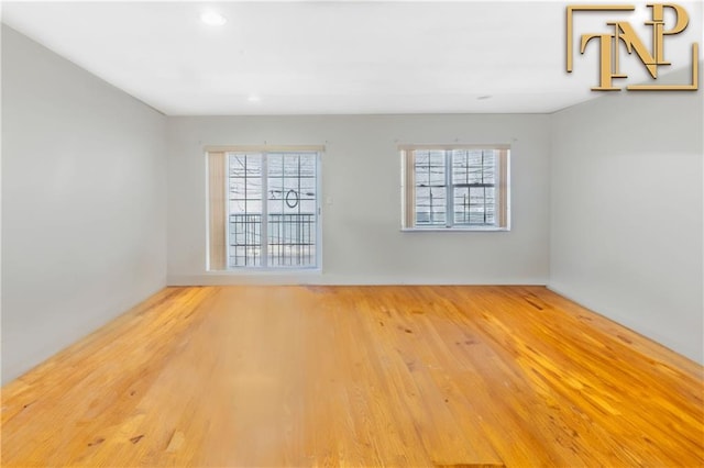 9526 Schenck St Unit 2, Brooklyn, NY 11236 - empty room with plenty of natural light, wood finished floors, and recessed lighting