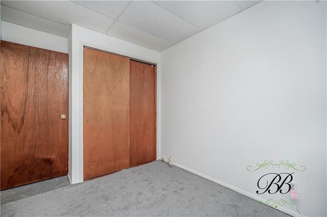 1859 E 34th St, Brooklyn, NY 11234 - unfurnished bedroom featuring carpet flooring, baseboards, and a paneled ceiling