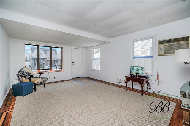 1859 E 34th St, Brooklyn, NY 11234 - living area with a paneled ceiling, baseboards, and a wall mounted air conditioner