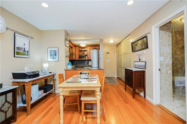 dining area with recessed lighting and light wood-style flooring