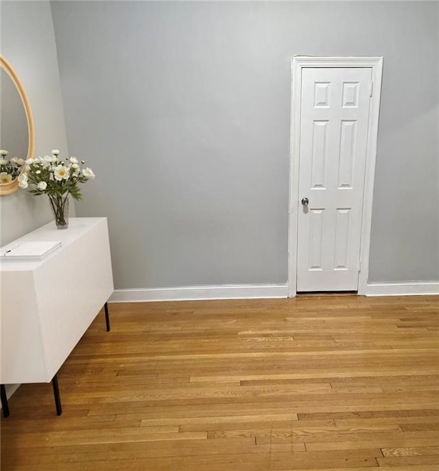 interior space with light wood-style flooring and baseboards