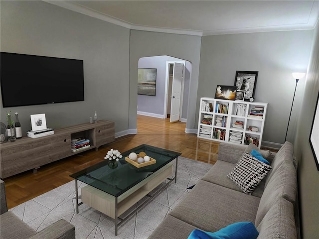 living area with baseboards, ornamental molding, and arched walkways