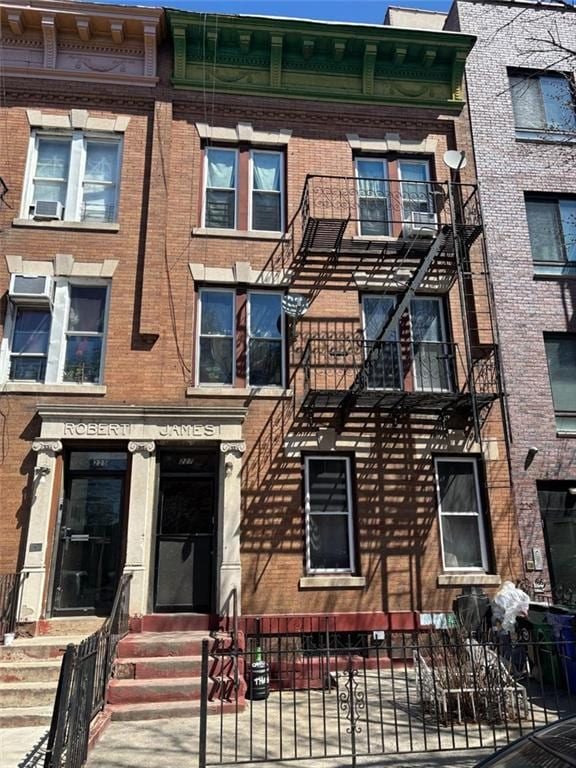227 55th St, Brooklyn, NY 11220 - townhome / multi-family property featuring brick siding and entry steps