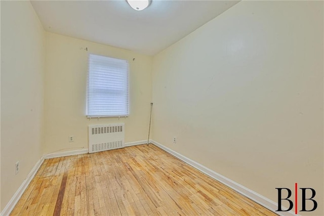 2076 E 63rd St, Brooklyn, NY 11234 - spare room with radiator, hardwood / wood-style flooring, and baseboards