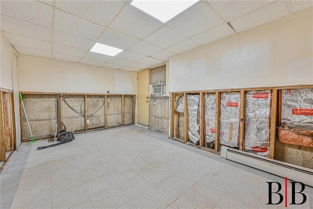 2076 E 63rd St, Brooklyn, NY 11234 - basement with a paneled ceiling, a baseboard radiator, and tile patterned floors