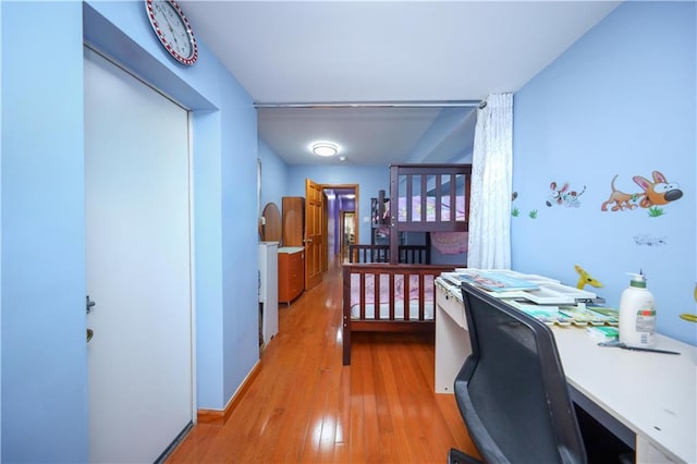 bedroom featuring light wood-type flooring
