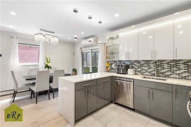 kitchen with decorative backsplash, stainless steel dishwasher, a sink, a peninsula, and gray cabinets