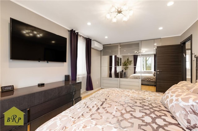 bedroom with wood finished floors, a wall mounted air conditioner, crown molding, and recessed lighting