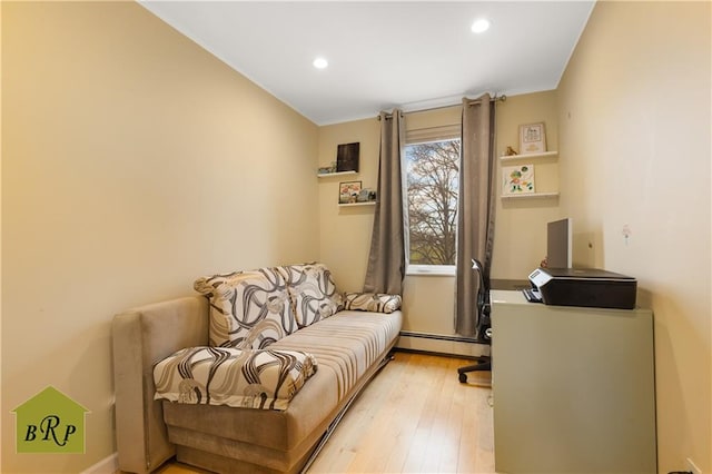 interior space featuring light wood-style floors, recessed lighting, and baseboard heating