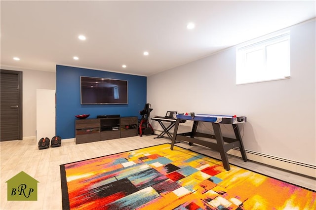game room with recessed lighting and wood finished floors