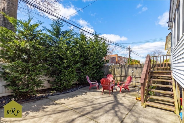 view of patio featuring fence