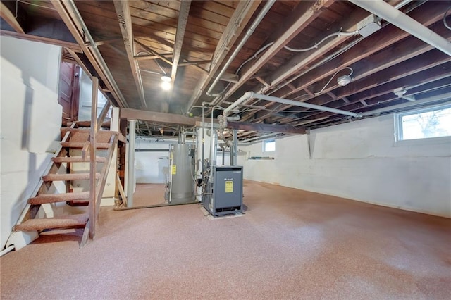 447 Greeley Ave, Staten Island, NY 10306 - basement featuring gas water heater, stairs, and a heating unit