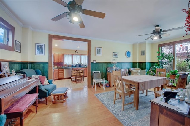 447 Greeley Ave, Staten Island, NY 10306 - dining room featuring wainscoting, healthy amount of natural light, ceiling fan, light wood-style flooring, and crown molding